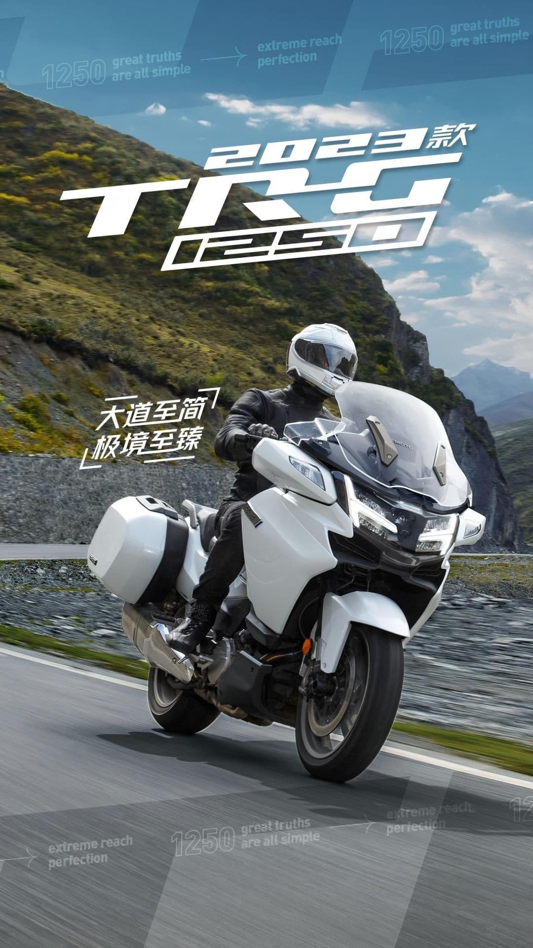 A rider on a white Yamaha Tracer 9 GT touring motorcycle on a winding mountain road.