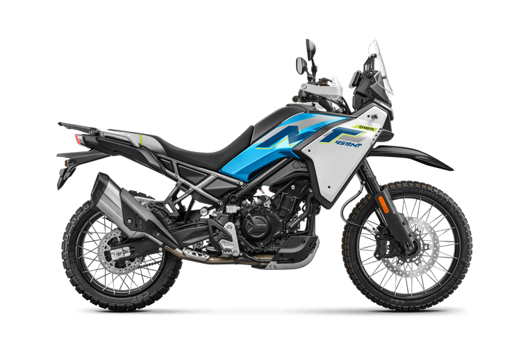 Side profile of a white and blue adventure bike, showcasing its large exhaust and dynamic design.